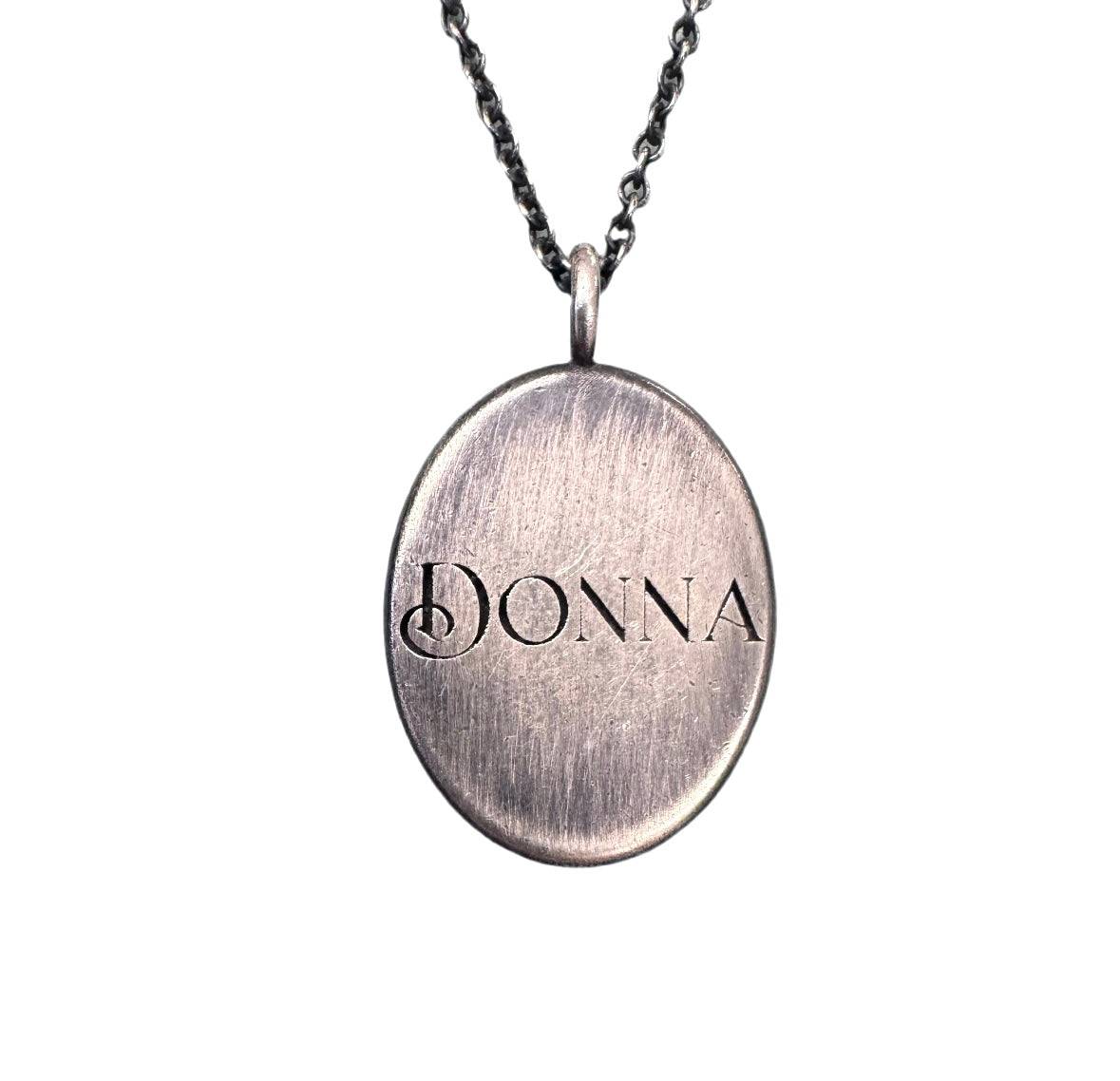 Custom oval pendant in solid sterling silver with personalized serif font engraving
