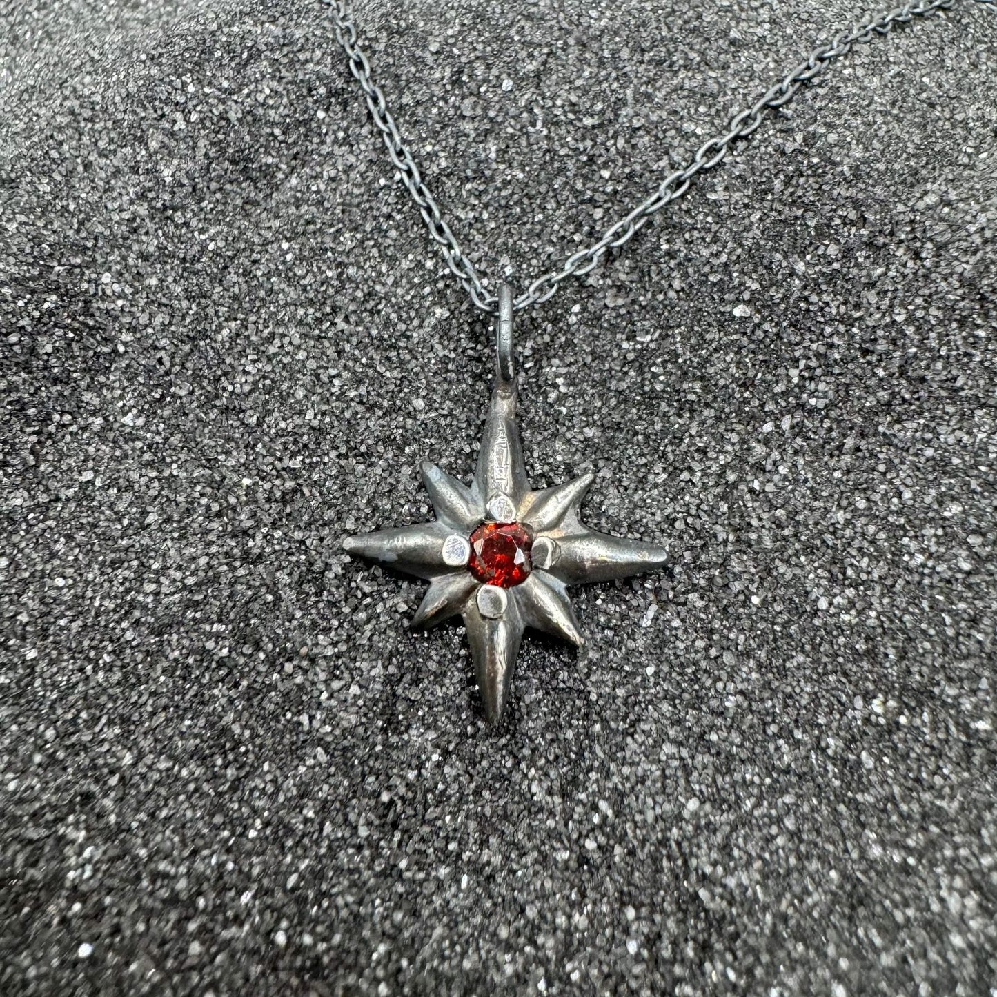Sterling silver star burst necklace with 3mm garnet stone pendant on 18 inch chain