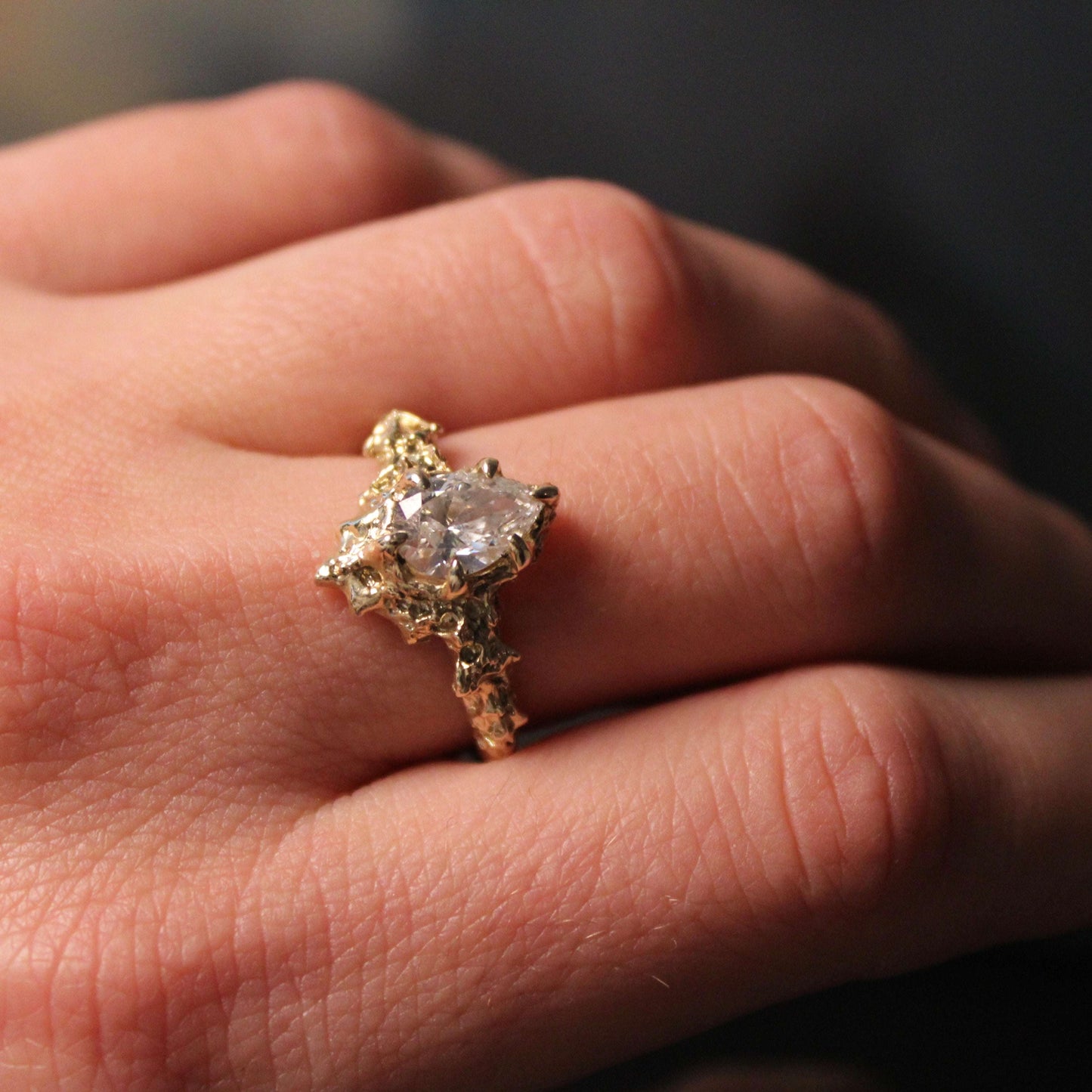 Lab Created Pear Floresco Ring with 1 carat diamond set in 14k yellow gold on hand