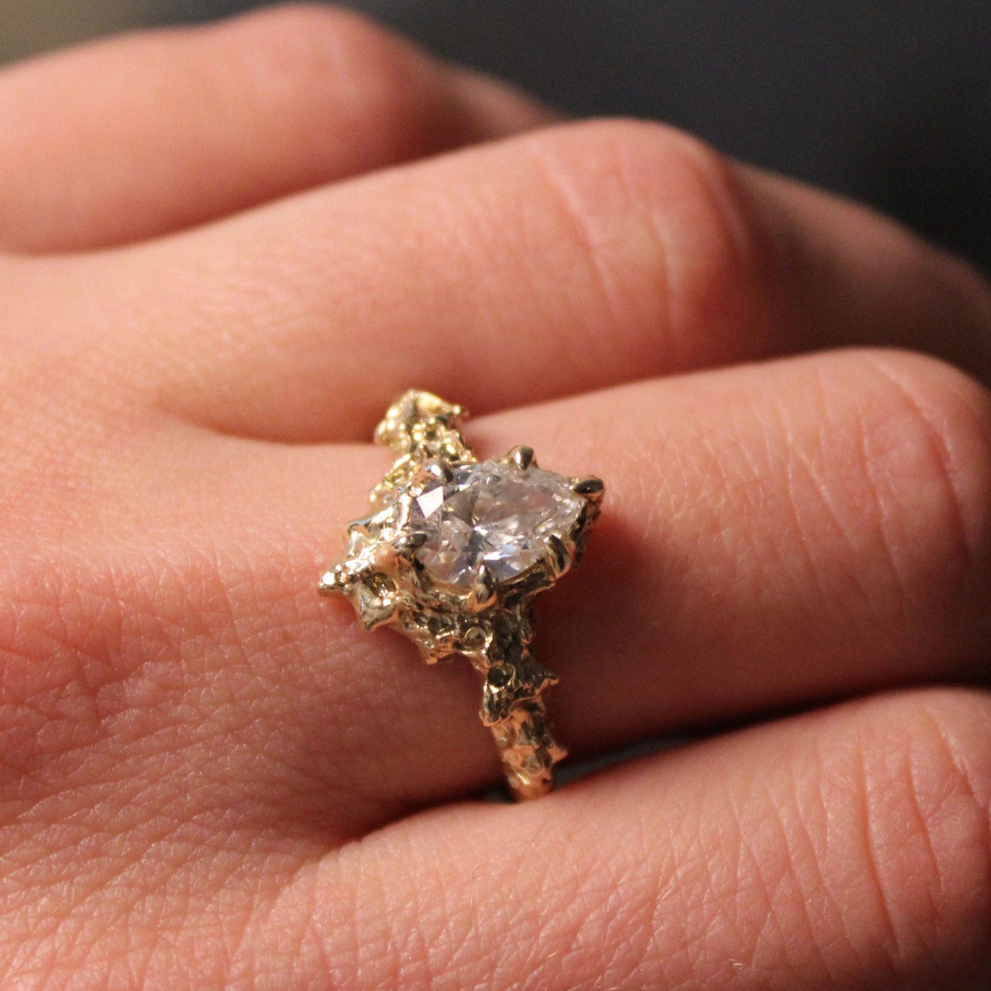 Lab Created Pear Floresco Ring with 1 carat diamond set in 14k yellow gold on hand