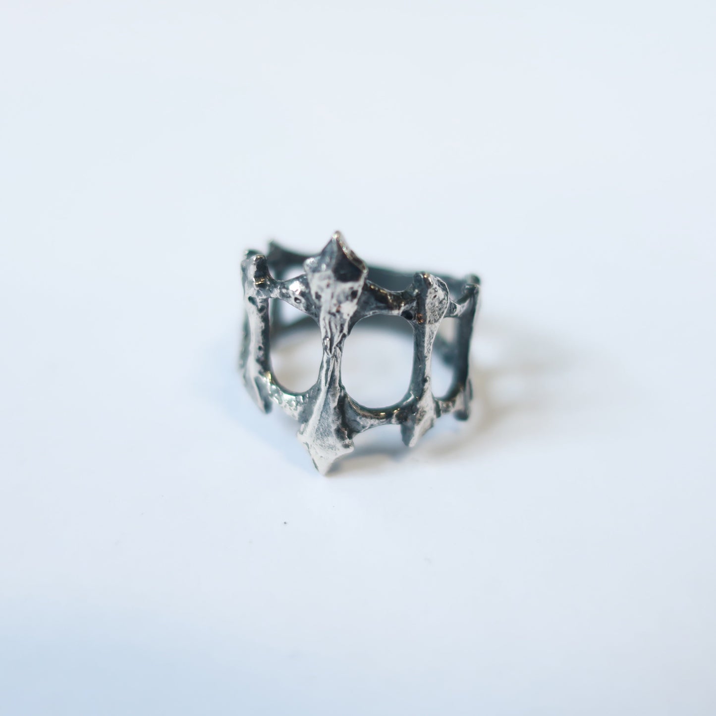 Hand carved sterling silver Spire Ring inspired by ancient weaponry and iron gates with tapered back for comfort