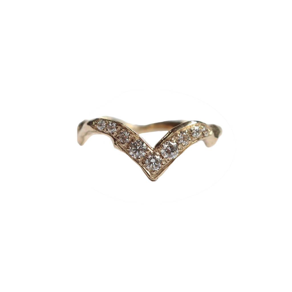 14 karat gold V-shaped stacking band with seven pave set white diamonds