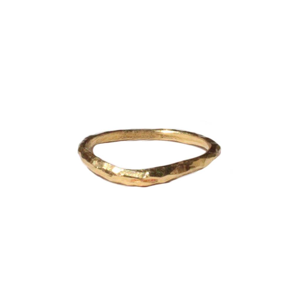 Thin curved gold band with textured surface isolated on white background