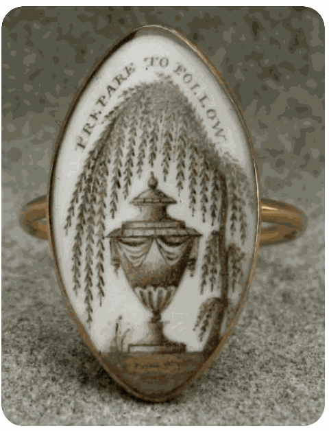 Victorian mourning jewelry brooches with intricate black designs and motifs of grief and remembrance