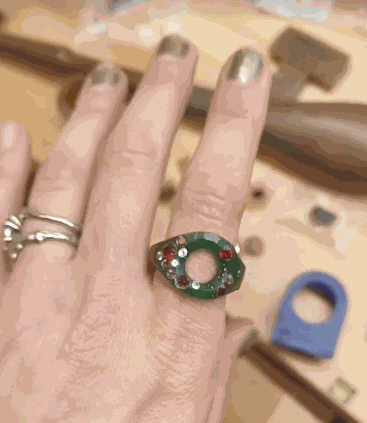 artisan carving intricate wax model for jewelry making process