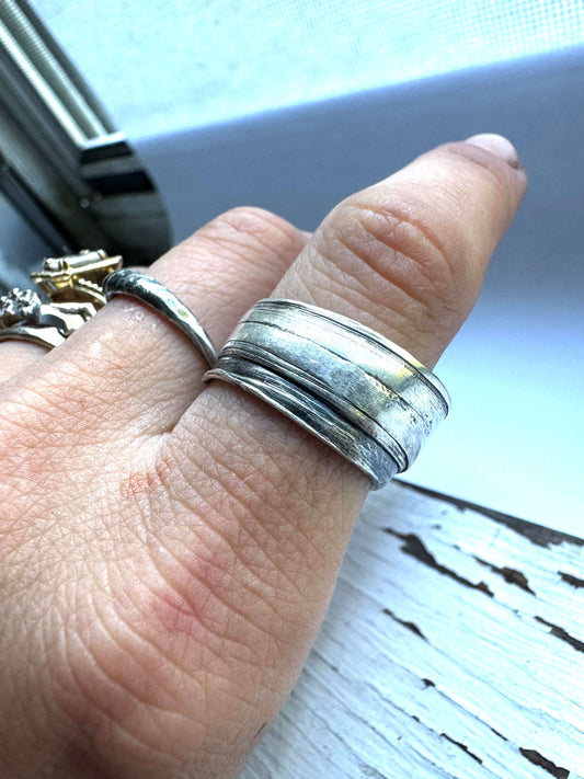 Thick wrap cigar band sterling silver size 7.5 on white background