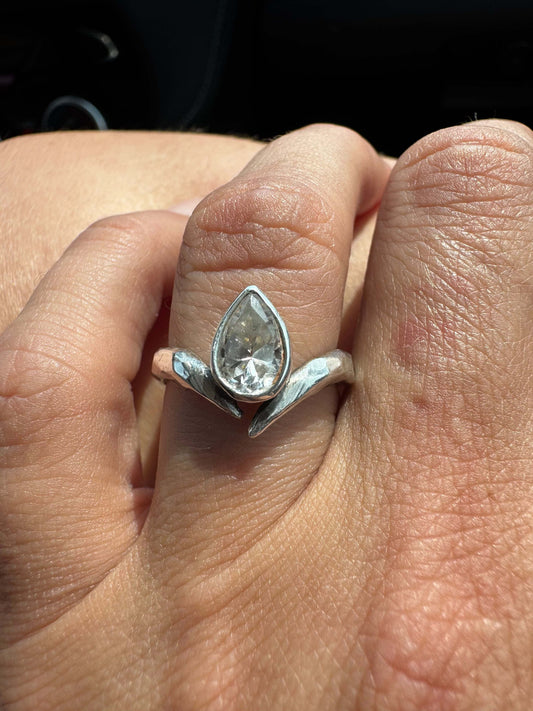 Asymmetrical band with pear bezel in sterling silver
