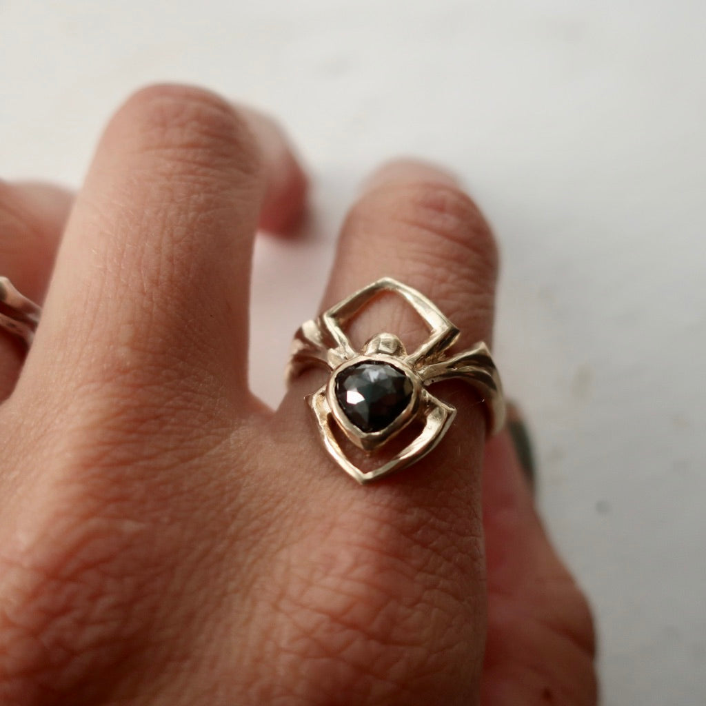 Gold diamond spider ring on model